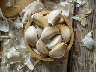 The garlic on wood table for food or cooking concept.