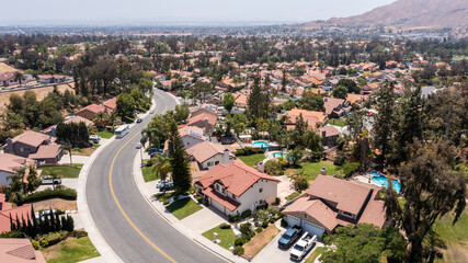 Daytime aerial view of a suburban neighborhood in Moreno Valley, California, USA.