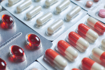 Many multicolored pills and tablets. Close up