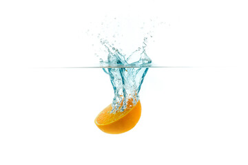 orange slice in water splash on white background