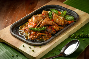 Close up Spicy fried fish is Thai food with herb