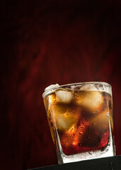 A cool glass of cola drink with ice