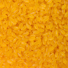 Golden rice on white background