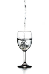 water splash in glasses isolated on white