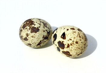 Fresh quail eggs isolated on a white background.