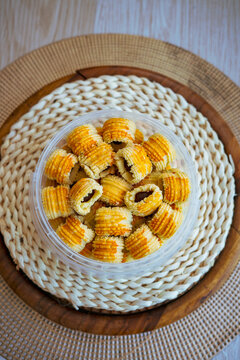 Traditional pineapple jam tart roll cookies or a malay called tart nanas in a plastic container.