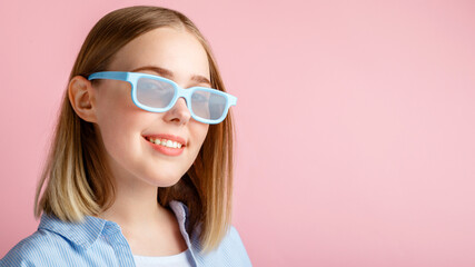 Smiling teenager girl portrait movie viewer in glasses isolated over pink color background with copy space. Young woman in cinema glasses for watching 3d movie in cinema. Long web banner