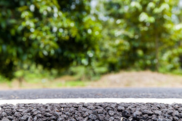 Old wood which is sideway of road in rural and tree background