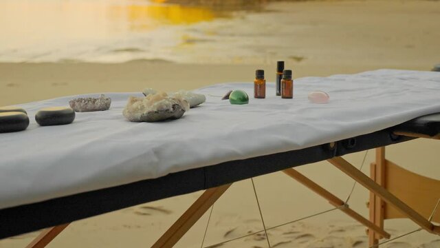Massage Table With Essential Oils, Crystals, Yoni Eggs, And Stone. - slider shot
