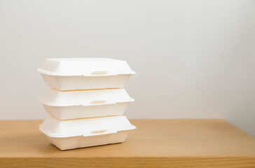 Food containers box on wood table. Food delivery service.