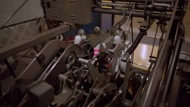 Bowling Pins Being Reset By A Pinsetter Machine At A Bowling Alley.