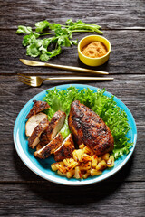 Jerk chicken breasts with grilled ananas cubes