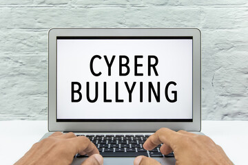 Cyber Bullying concept on a laptop screen.