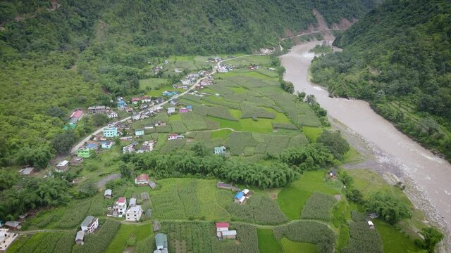 Landscape of hill with farm houses in Gulmi Nepal, aerial video