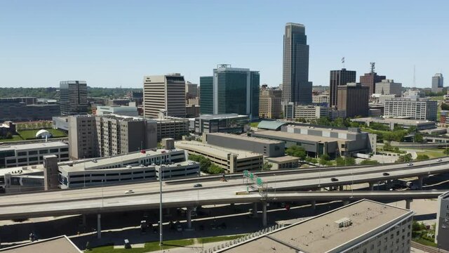 Cars Driving on Highway with Downtown Omaha, Nebraska Skyline in Background