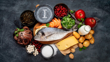 Fototapeta na wymiar Food high in iodine on dark gray background. Healthy eating concept.