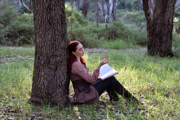 portrait of red haired girl wearing fantasy medieval clothes of a wandering adventurer.  natural...