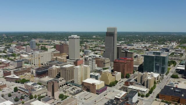Drone Flies Away from Downtown Omaha, Nebraska Skyscrapers in Daytime