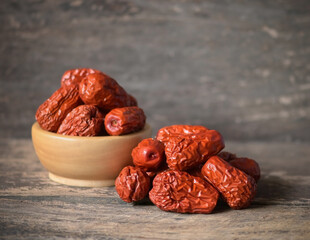 Chinese jujube isolated on wooden background.