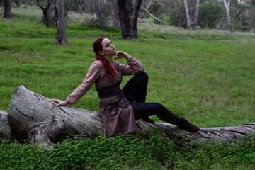 portrait of red haired girl wearing fantasy medieval clothes of a wandering adventurer.  natural...