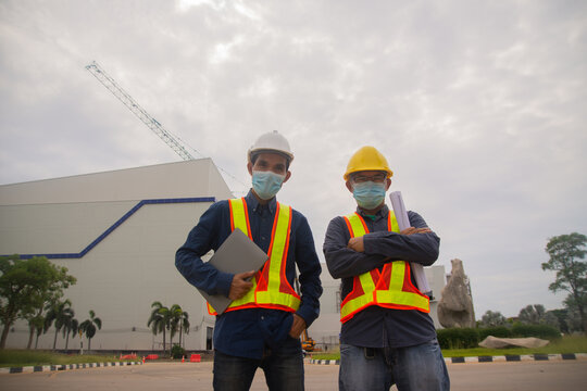 Two Engineer Work Smart On Site Building Construction