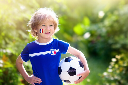 France football fan kids. Children play soccer.