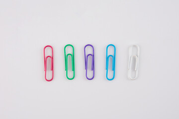 Colorful paper clips isolated on white background