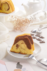 A marble cake is a cake with a streaked or mottled appearance (like marble) achieved by very lightly blending light and dark batter. It can be a mixture of vanilla and chocolate cake
