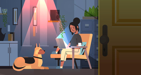 overworked businesswoman freelancer looking at laptop screen woman with dog working in dark night home room - obrazy, fototapety, plakaty