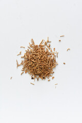 Dried ginseng roots on isolated white background