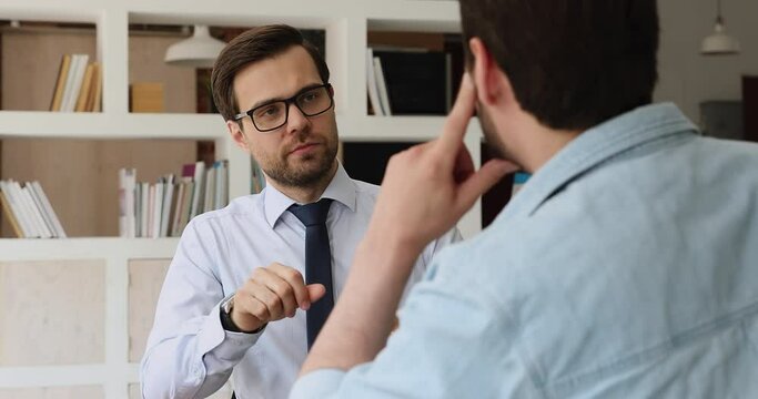 Skilled financial advisor giving professional consultation to client. Two business partners discussing project ideas in office. Concentrated hr manager boss holding job interview with candidate.