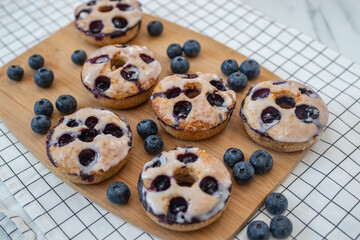sweet home made blueberry donuts on a table