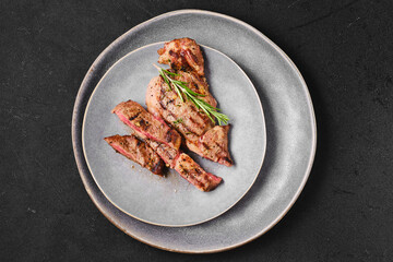 Overhead view of ribeye steak on a plate