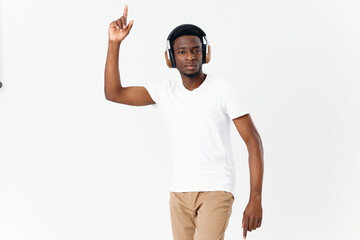 man in headphones gesturing with hands music technology fun isolated background