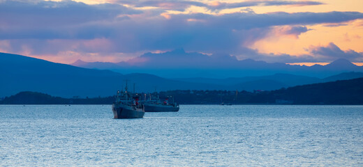 fishing ships at sunset in the Avacha Bay on the Kamchatka Peninsula