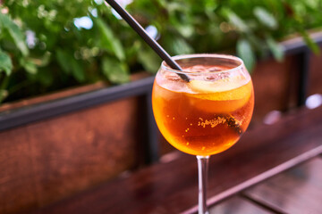 Aperol Spritz cocktail aperitif outdoors with shallow depth of field
