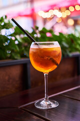 Aperol Spritz cocktail aperitif outdoors with shallow depth of field