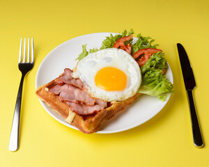 Waffle wholesome breakfast. Sour waffles with fried eggs, delicious sauce and fresh vegetables.