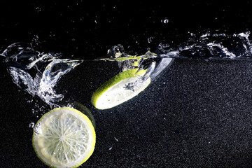 Obraz na płótnie Canvas Water drops on ripe sweet lemon. Fresh lime background with copy space for your text. Vegan concept.