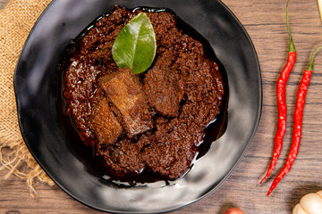 Beef Rendang is a Minang dish originating from the Minangkabau region in West Sumatra, Indonesia.  Rendang has been slow cooked and braised in a coconut milk seasoned with a herb and spice mixture