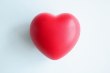 Small red heart on blue blurred background