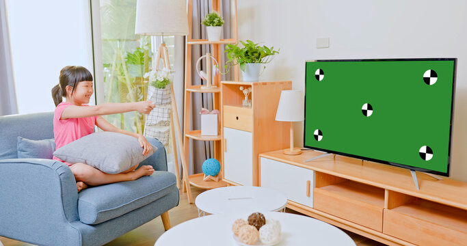 asian girl watching tv - Powered by Adobe
