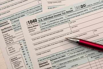 close up of empty us tax form 1040 and ballpoint pen