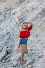 beautiful  girl walking on the sand with blue sky