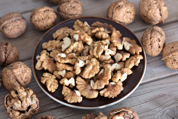 A plate of walnuts and some walnuts