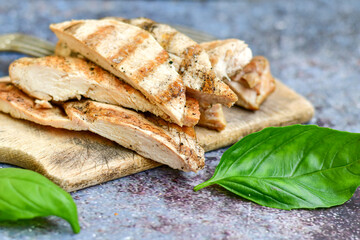  Grilled chicken fillets with  olive oil, chili pepper,   and tomato paste 
