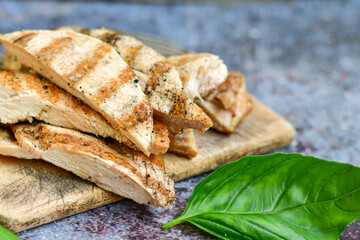  Grilled chicken fillets with  olive oil, chili pepper,   and tomato paste 
