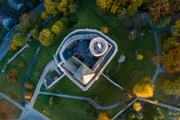Medieval gothic castle in Bedzin, Upper Silesia, Poland. Aerial view from above in fall in sunrise light