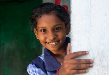 Close-up portrait of a rural school girl Catching a wall