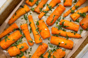 Homemade Roasted Carrots with Herbs, top view. Flat lay, overhead, from above. Close-up.